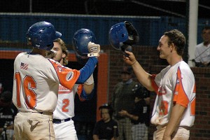 Marshall's Corey Bird is welcomed at home plate by teammates RYne Birk (2) and Austin Hays (29) after his towering home run off of the right-field scoreboard at McKeon Park Thursday night as Hyannis beat Bourne 10-3 in game one of the West Finals. Sean Walsh/Capecod.com Sports 