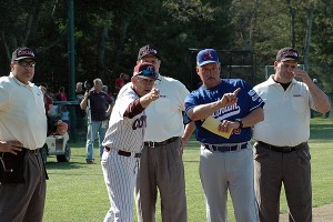 Chatham Anglers' field manager John Schiffner goes over ground rules at Lowell Park in Cotuit with Kettleers' field manager Mike Roberts in recent Cape League action. Schiffner won his 500th career game last night against the Kettleers. Sean Walsh/Capecod.com Sports