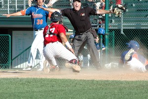 Home plate umpire John Leeds calls Hyannis' Jake Rogers safe as he slides past Cotuit catcher Will Haynie in the second innng of last night's 6-2 Harbor Hawks' win. Sean Walsh/Capecod.com Sports