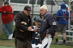 Home Plate Umpire Mark Ottavianelli goes over the lineup with Coach Corradi.