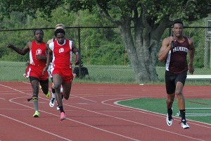 Falmouth's Craig Green burns rubber in the boys' 4x100 relay. Sean Walsh/Capecod.com Sports