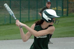 Dolphin slugger Patty Newhard locks into the pitch.