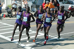 Stephen Sambu and Micah Kogo turn the corner. Sean Walsh/Capecod.com Sports