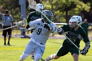 Dennis-Yarmouth's Ian Crosby lowers the boom on a Canton defender in the Dolphins' 5-4 south sectional victory - a school first. Phil Garceau/Capecod.com Sports