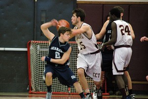 Cape Cod Academy senior guard Jack Massari tries to steal the ball from Cape Tech's Josh Meservey in Saturday afternoon's 55-51 Crusaders' upset. Sean Walsh/Capecod.com Sports