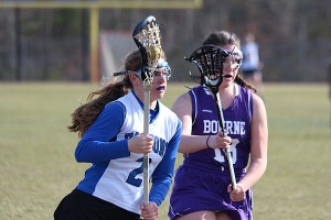 Mashpee High School's Jackie Lynch (2) races past Bourne High's Molly Powers in Monday's 13-13 deadlock. Lynch had four assists. Phil Garceau Photo for Capecod.com Sports
