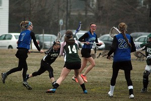 Falmouth Academy's Jane Earley (7) shoots and scores in girls lacrosse action last week. Earley had six goals and five assists in yesterday's 18-1 win over Sturgis East. Sean Walsh/Capecod.com Sports Photos