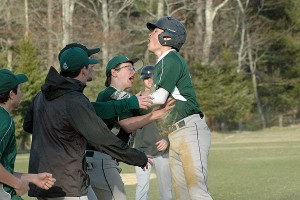 The Sturgis West bench mobs Jonathan Avis when he scores the winning run in Thursday's 4-3 affair at Cape Cod Academy. Sean Walsh/Capecod.com Sports Photos