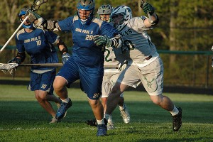 St. John Paul II's Alan Fox (29) tries to elude the D-Y Dolphin horde in action last week. Both teams qualified for the postseason. Sean Walsh/Capecod.com Sports