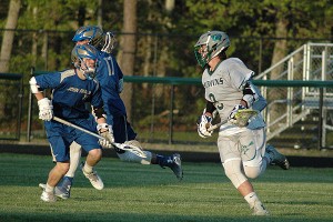 Dennis-Yarmouth's Ian Crosby (9) scored two goals and added five assists to pace the Dolphins to an 11-3 win over St. John Paul II Friday night. Sean Walsh/Capecod.com Sports