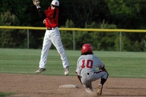 Barnstable second baseman Lukas Atsalis leaps to catch the ball on a steal. Sean Walsh/Capecod.com Sports