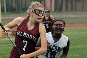 Falmouth's Savannah Jensen (7) speeds past Mashpee's Zada Green in yesterday's 9-7 season finale for both squads. Sean Walsh/Capecod.com Sports