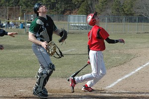 Dennis-Yarmouth catcher Mike Dunn watches the flight of a foul ball off the bat of Barnstable High shortstop J.R. DiSarcina in Monday's season-opening win for the Dolphins. Sean Walsh/Capecod.com Sports