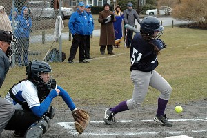 With St. John Paul II catcher Hadley Tate behind the dish, Sturgis East's Nicole Collucci leads off Tuesday's game with a basehit. Collucci went 2-3. Sean Walsh/Capecod.com Sports