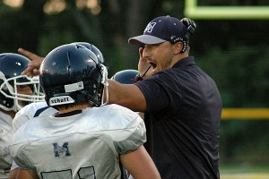 Monomoy head coach ROss Jatkola inspires his players during a time-out in Friday night's scrimmage against Nauset and Cape Tech. Sean Walsh/Capecod.com Sports