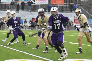 Bourne High's Ryan Pezzone reaches for the loose ball in front of Nauset's DJ Telman in yesterday's 10-9 Nauset win in overtime. Phil Garceau photo for Capecod.com Sports