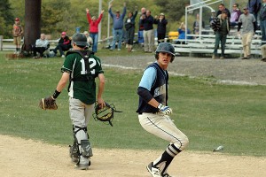 Sandwich High's Riley Sorenson scores the game-winning run. The fans in the background approved. Sean Walsh/Capecod.com Sports