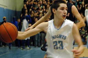 Sandwich High School junior forward Andrew Galanek played spectacular defense and turned in 14 points to help lead the Blue Knights to a 65-50 Division 2 South Sectional quarterfinals victory over Walpole last night. Sean Walsh/Capecod.com Sports