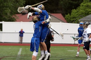 St. John Paul II's Brian Hyde and Gil Bach celebrate one of Hyde's goals but the Lions simply could not match up with the host Archbishop Williams' team. Phil Garceau/Capecod.com Sports