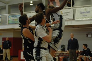 Nantucket's Kyle-Andrew Irving and Sturgis East's Cole Woodbury leap for the rebound as Nantucket's Riley Fusaro and the Storm's Evan Tambert join the fray in last night's 73-45 Whaler win. Sean Walsh/Capecod.com sports