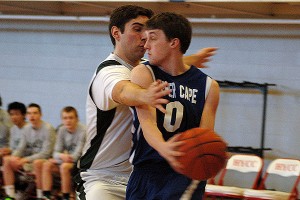 Sturgis West's John Russell blocks the passing lane from Upper Cape Tech co-captain Austin Smolinsky in Tech's 61-49 victory yesterday in Hyannis. Sean Walsh/Capecod.com Sports