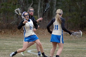 St. John Paul II's Casey Sullivan (19) and Mikenzie Carbone (11) each netted hat tricks in a tough, 9-8 loss Tuesday to Old Rochester. Sean Walsh/Capecod.com Sports Photos