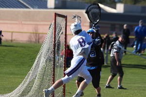 Bourne High School's Tom Glinski nets the overtime gamewinner in Friday's 9-8 SCC lacrosse tilt against Fairhaven. Phil Garceau photo for Capecod.com Sports