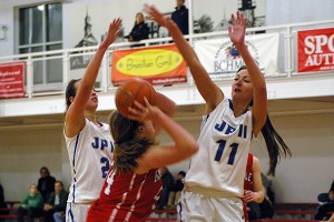 St. John Paul II sisters Haylee (2) and Kaia Whiteley (11) teamed up yesterday for 11 points apiece in the Lions' 39-25 victory over Sturgis West. Sean Walsh/Capecod.com Sports File Photo