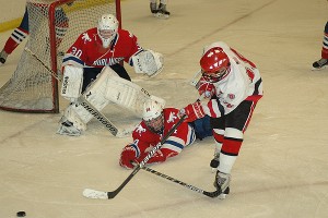 Barnstable's Alex Barattini has his third period shot deflected by Burlington's Robby Ryan as goalie Nick Howard guards his crease. Sean Walsh/www.capecod.com sports