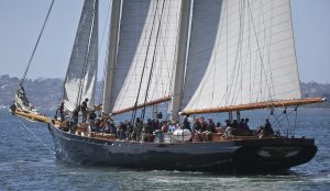 America, a 139 foot replica of the original America's Cup yacht, cruises with sightseers in San Diego Bay Friday, April 1, 2016, in San Diego. Sailor and businessman Troy Sears is heading out on an epic nautical road trip that might not end until he's circled the globe with his schooner America, a replica of the boat that gave the America's Cup its name. (AP Photo/Lenny Ignelzi)