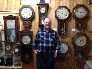 NANCY RUBIN STUART PHOTOS John Anderson surrounded by a wall of clocks.