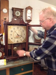John Anderson works on an early 19th century time piece.