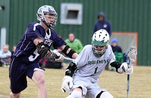 Dennis-Yarmouth's Andrew Jamiel netted three goals in the Dolphins' season-opener yesterday, an 8-2 win over Plymouth North at Allen Carlsen Field. Phil Garceau photo for Capecod.com Sports