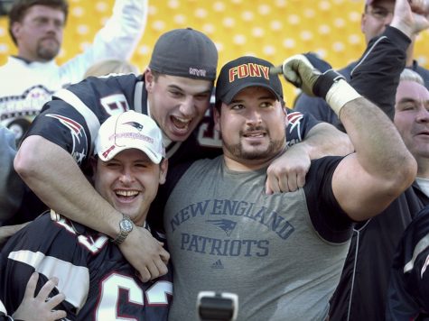 ** FILE ** New England Patriots Joe Andruzzi, right, celebrates with family in the stands after their AFC Championship game against the Pittsburgh Steelers in this file photo taken Sunday, Jan. 27, 2002 in Pittsburgh. Andruzzi, 32, a member of all three of the Patriots Super Bowl championship teams during five years with the club, was diagnosed with non-Hodgkin's lymphoma in May 2007 and is undergoing treatment in Boston. (AP Photo/Amy Sancetta)