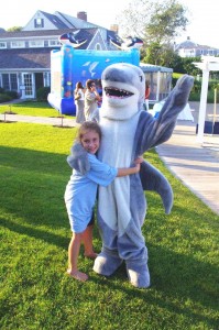 PHOTO COURTESY ATLANTIC WHITE SHARK CONSERVANCY Anneliese McGowan and her shark friend share a bonding moment.