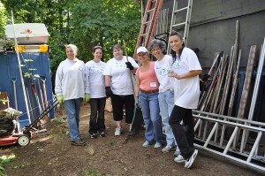 Volunteers pose at a Big Fix in Mashpee two years ago. 