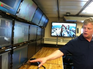 The ship's computer room has monitors that show measurements and survey tools.