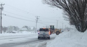 Crews clear snow in Dennis during Monday's storm