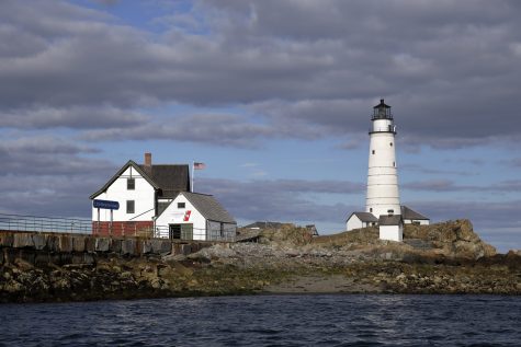 In this Aug. 17, 2016 photo, Boston Light, America's oldest lighthouse, sits on Little Brewster Island in Boston Harbor. The U.S. Coast Guard's last manned station will celebrate the 300th anniversary of its first lighting on September 14th. (AP Photo/Elise Amendola)
