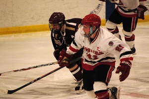 Barnstable senior hockey captain Donnie Brodd races to the puck with Newburyport's senior assistant captain Ty Therrien, Brodd scored two goals and had two assists in the Red Raiders' 7-3 win. Sean Walsh/www.capecod.com sports