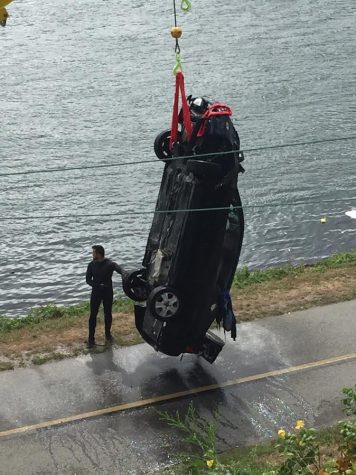 CCB MEDIA PHOTO: A car that was driven in the Cape Cod Canal in September is removed from the water
