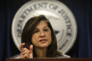 U.S. Attorney Carmen Ortiz responds to questions from reporters during a news conference at the federal courthouse, Thursday, June 9, 2016, in Boston. Law enforcement officials say more than 60 alleged gang members from Boston and other cities in eastern Massachusetts have been charged with drug, weapons and racketeering charges. (AP Photo/Steven Senne)