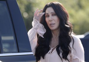 Singer and actress Cher stops to talk to media as she leaves a fundraiser for Democratic presidential candidate Hillary Clinton at the Pilgrim Monument and Provincetown Museum in Provincetown, Mass., Sunday, Aug. 21, 2016. (AP Photo/Carolyn Kaster)