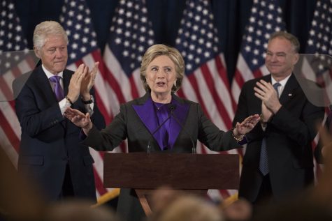Former President Bill Clinton, left, and  Democratic vice presidential candidate, Sen. Tim Kaine, D-Va.,applaud Democratic presidential candidate Hillary Clinton speaks in New York, Wednesday, Nov. 9, 2016, where she conceded her defeat to Republican Donald Trump after the hard-fought presidential election. (AP Photo/Matt Rourke)