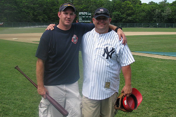 C-O-MM Firefighter Chris Rogers (left), a former Stetson University and Cotuit Kettleer standout pitcher poses with his former baseball coach Sean Walsh at Lowell Park in July 2010. Photo Courtesy of Sue Blanchette