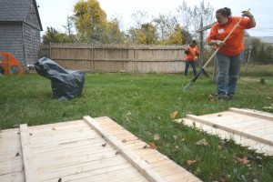 CCB MEDIA PHOTO Wendy Rosario of Wareham was one of of 25 volunteers to clean up Betsie Tracey's yard and home at the 2015 Big Fix. This year's event included stops at 12 Bourne homes