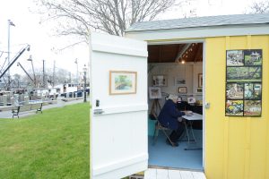 CCB MEDIA PHOTO Watercolor artist Leslie Altman at work in her temporary shop, an Artist Shanty at Bismore Park in Hyannis Harbor