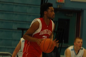Barntable High's Deon Bell, a senior transfer student, succeeded in shutting down New Bedford's star forward, Tyree Weston, holding him to just one point in the Red Raiders' 50-47 overtime win. Sean Walsh/CCBM Sports