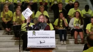 CCB MEDIA PHOTO Cape Downwinders co-founder Diane Turco holds up a card with the letter "F" to represent the grade the Pilgrim Nuclear Power Plant have given to the Plymouth facility