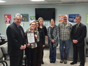Barnstable County Sheriff Jim Cummings (L) presents Heidi Nelson, the CEO of Duffy Health Center, with a citation in recognition of the Vivitrol program partnership between the two organizations 